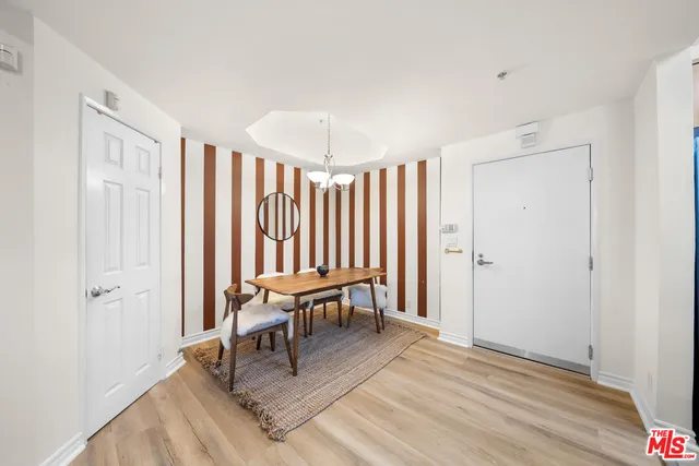 a view of a livingroom with furniture and wooden floor