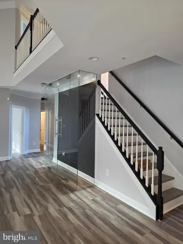 an empty room with windows and entrance