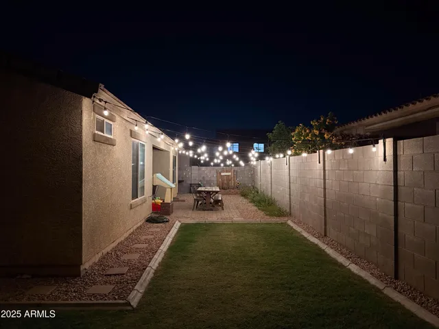 a view of a porch with furniture and yard