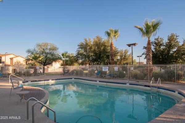a spacious bathroom with a granite countertop sink and a large mirror