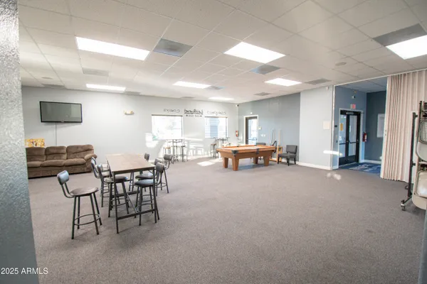 a lobby with furniture and a table