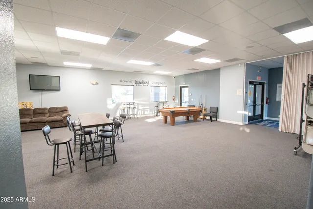 a lobby with furniture and a table