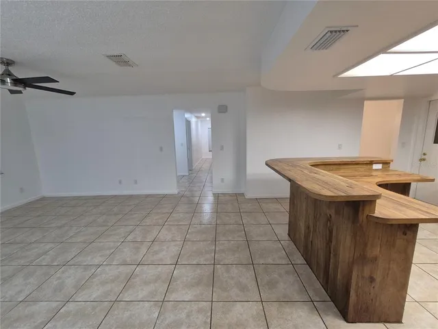 a kitchen with kitchen island a counter top space a sink and appliances