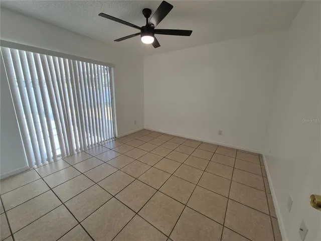 a view of an empty room and window