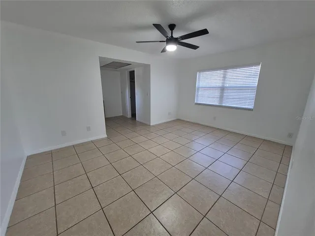 a view of a livingroom with furniture and a flat screen tv