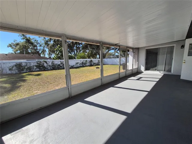a view of a hallway with windows