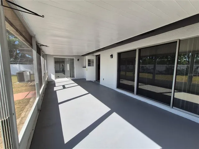 a view of a swimming pool and an outdoor seating