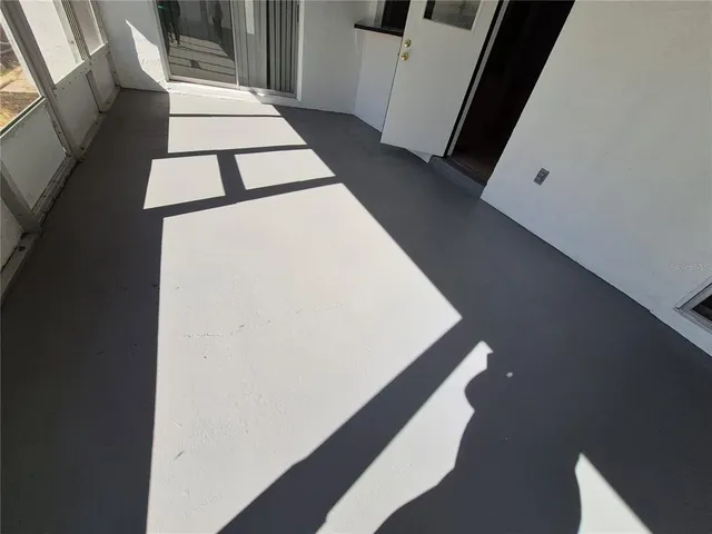 a view of a house with pool and sitting area