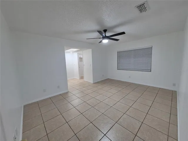 a view of kitchen with granite countertop window and front door