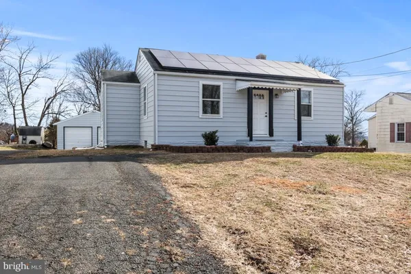 a view of house with yard