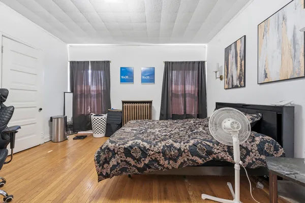 a bedroom with a bed and a table
