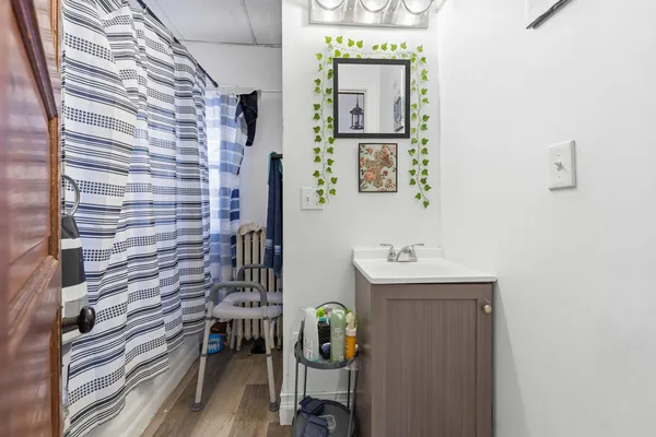 a bathroom with a sink a toilet and mirror