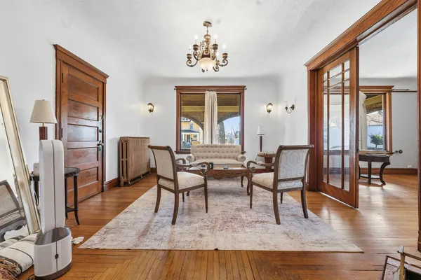 a view of a livingroom with furniture window and wooden floor