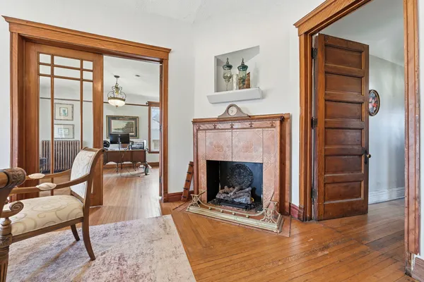 a living room with furniture and a fireplace
