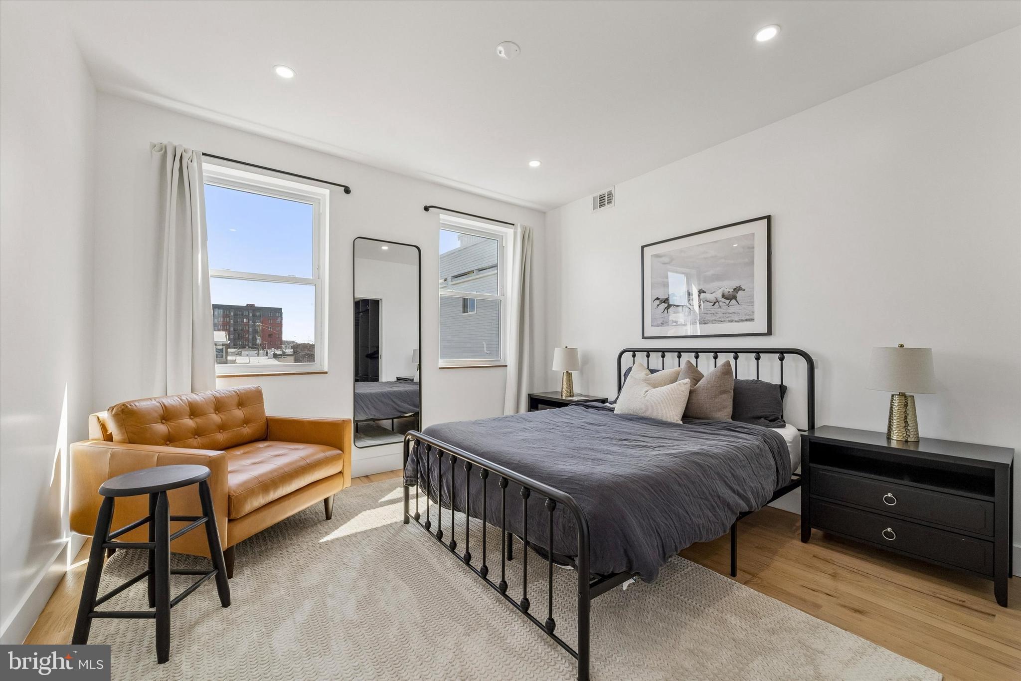 2565 Tulip Street Philadelphia, PA 19125 - Photo 12 of 15 a bedroom with a bed and a couch