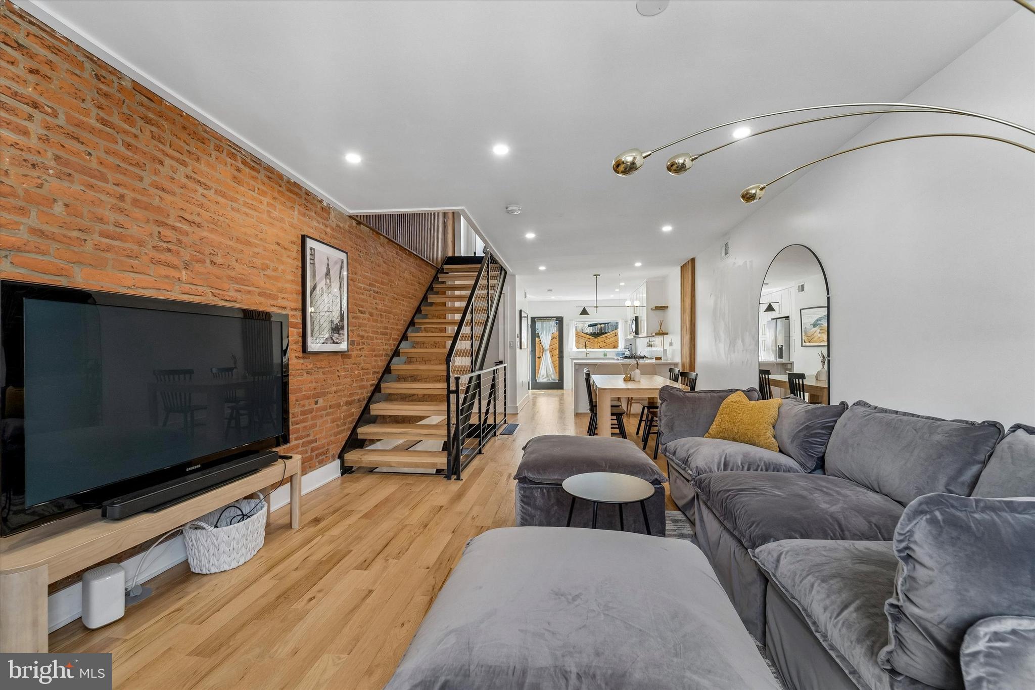 2565 Tulip Street Philadelphia, PA 19125 - Photo 2 of 15 a living room with furniture and a flat screen tv