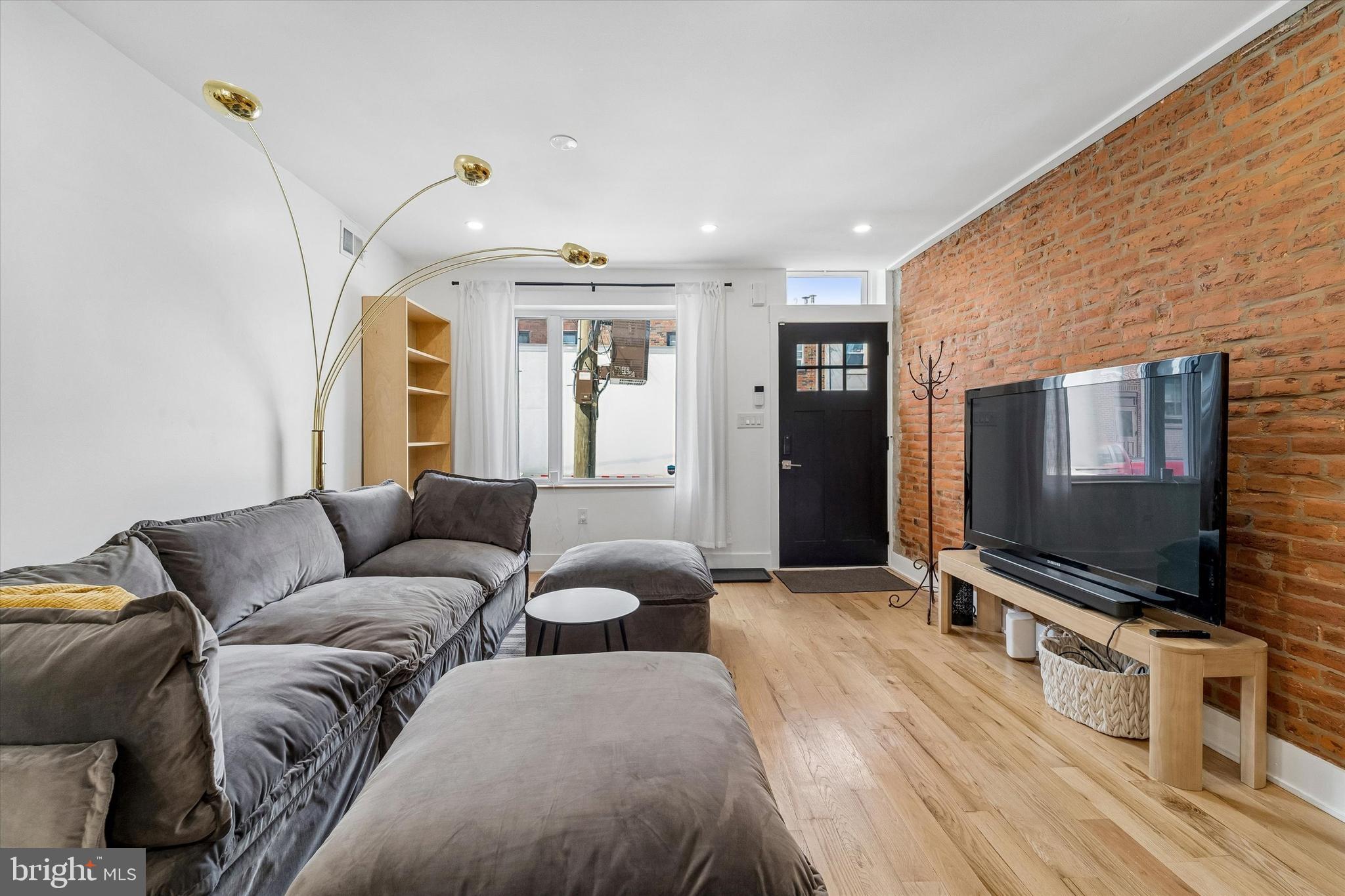2565 Tulip Street Philadelphia, PA 19125 - Photo 3 of 15 a living room with furniture and a flat screen tv