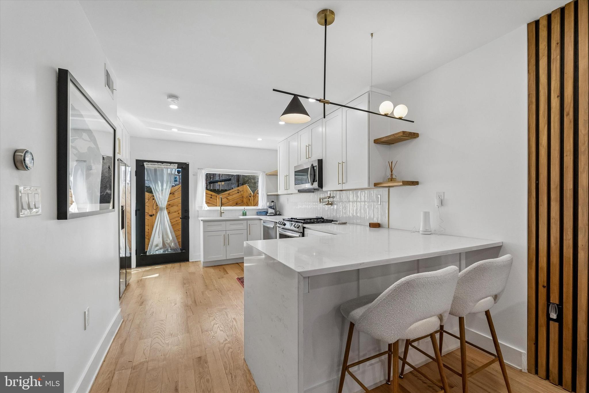 2565 Tulip Street Philadelphia, PA 19125 - Photo 5 of 15 a view of a kitchen and dining room