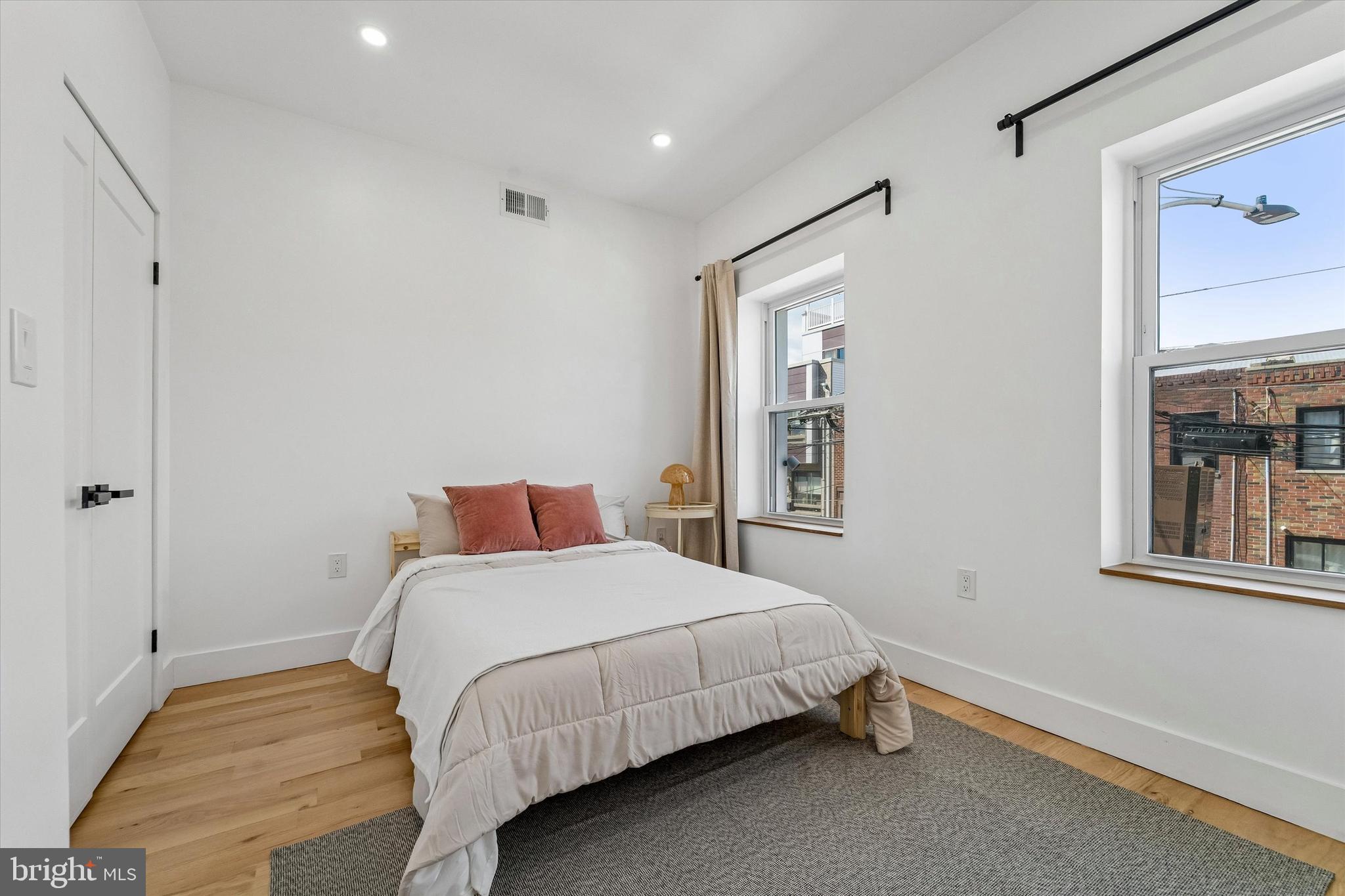 2565 Tulip Street Philadelphia, PA 19125 - Photo 9 of 15 a bedroom with a bed and a window