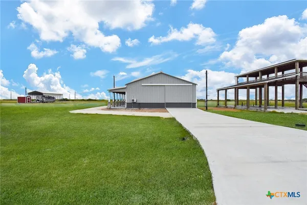 a view of a house with a big yard