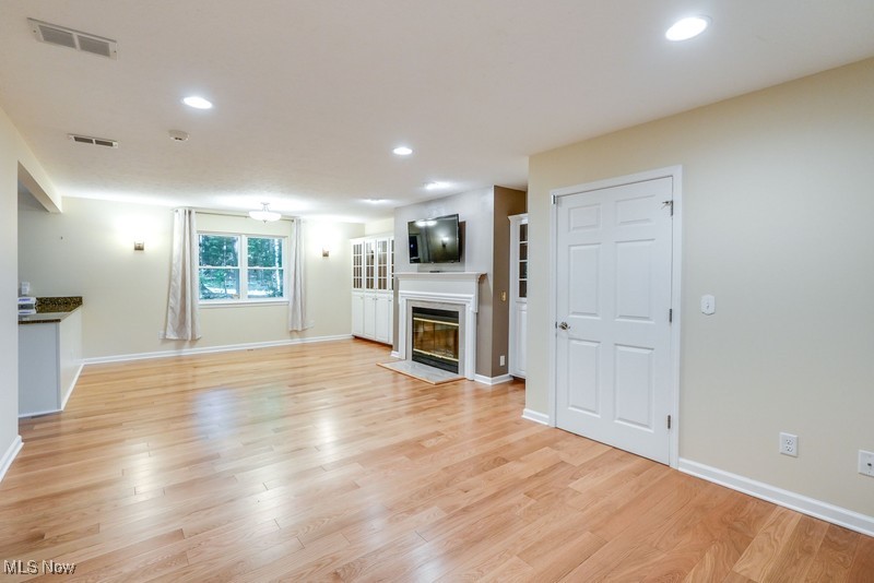 8648 Taylor May Road Chagrin Falls, OH 44023 - Photo 6 of 37 Unfurnished living room featuring light hardwood / wood-style floors