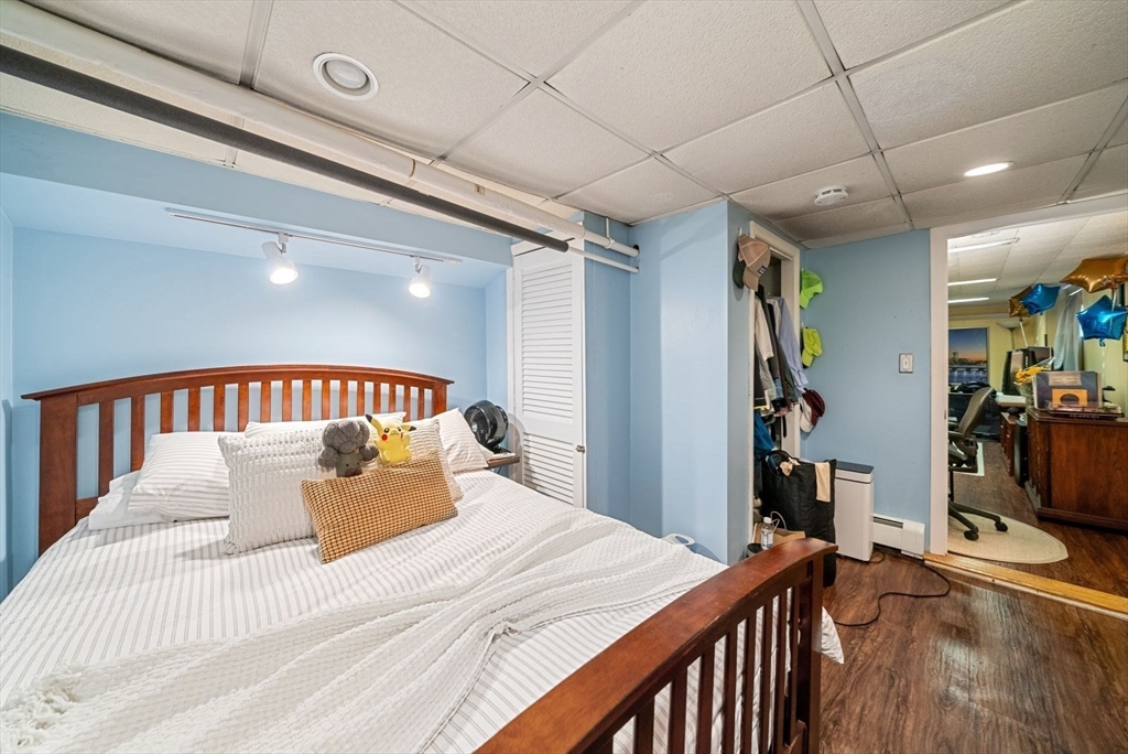 39-41 Donnybrook Road Boston, MA 02135 - Photo 16 of 37 a bedroom with a large bed and a large window
