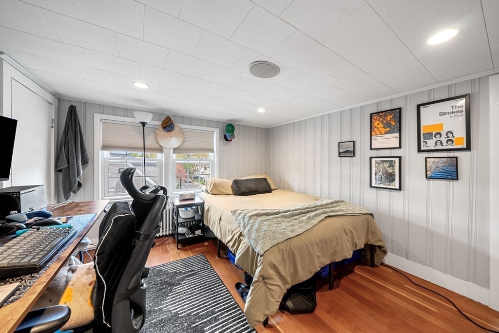 39-41 Donnybrook Road Boston, MA 02135 - Photo 29 of 37 a bedroom with a bed and a flat screen tv