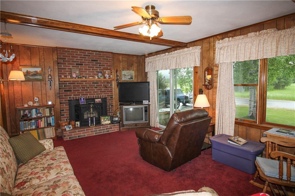 56 N Road Bethel, ME 04217 - Photo 6 of 22 Living room with pellet stove