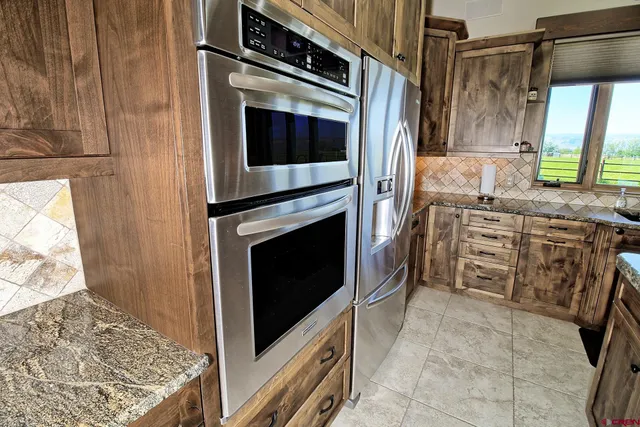a kitchen with a stove and a microwave