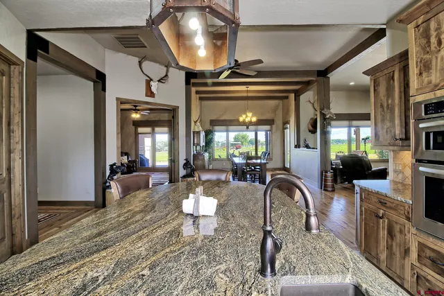 a living room with fireplace furniture and a flat screen tv