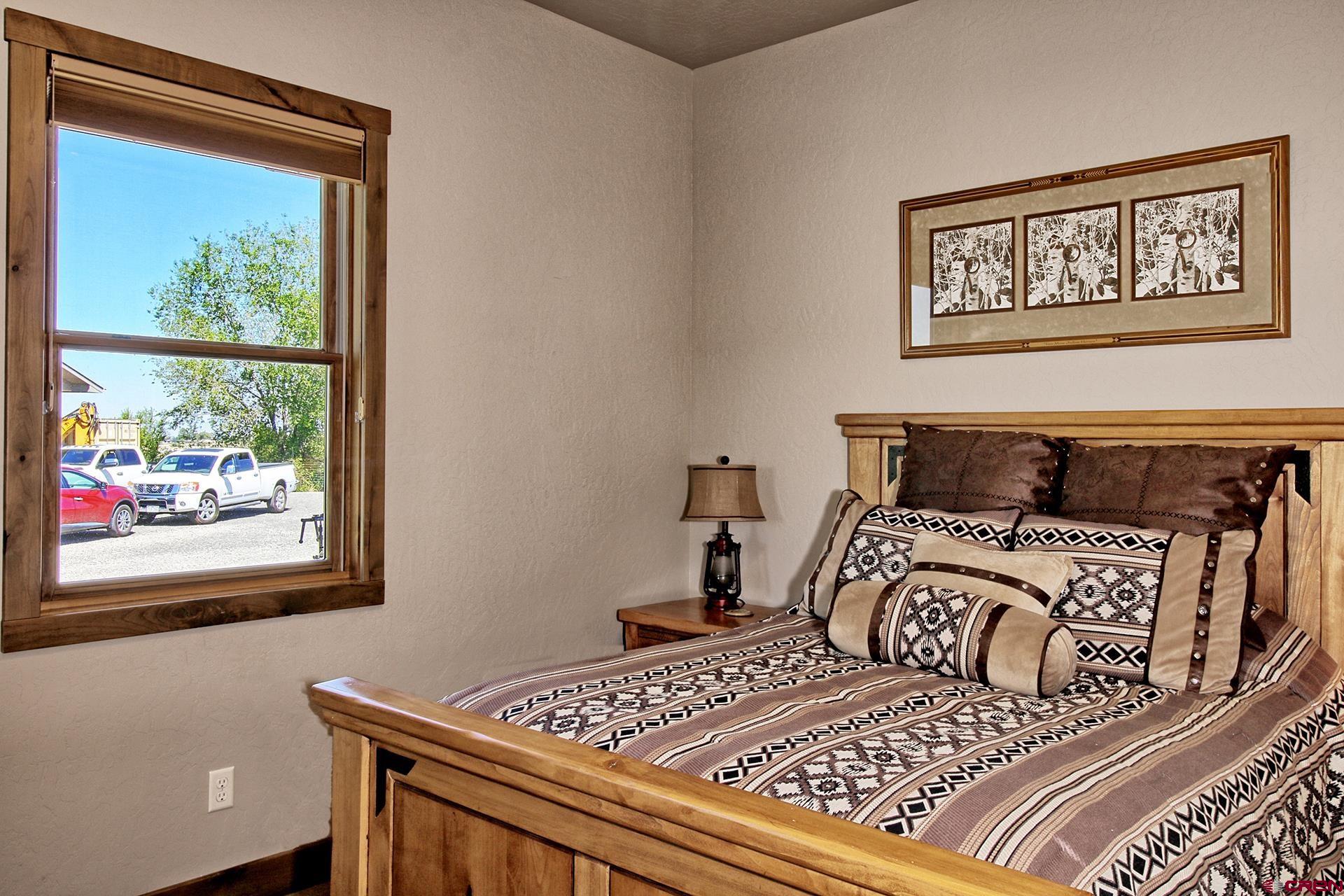 971 24 Road Grand Junction, CO 81505 - Photo 23 of 43 a bedroom with a bed and a window