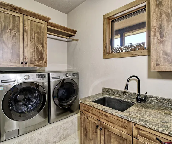 a kitchen with a stove and a sink