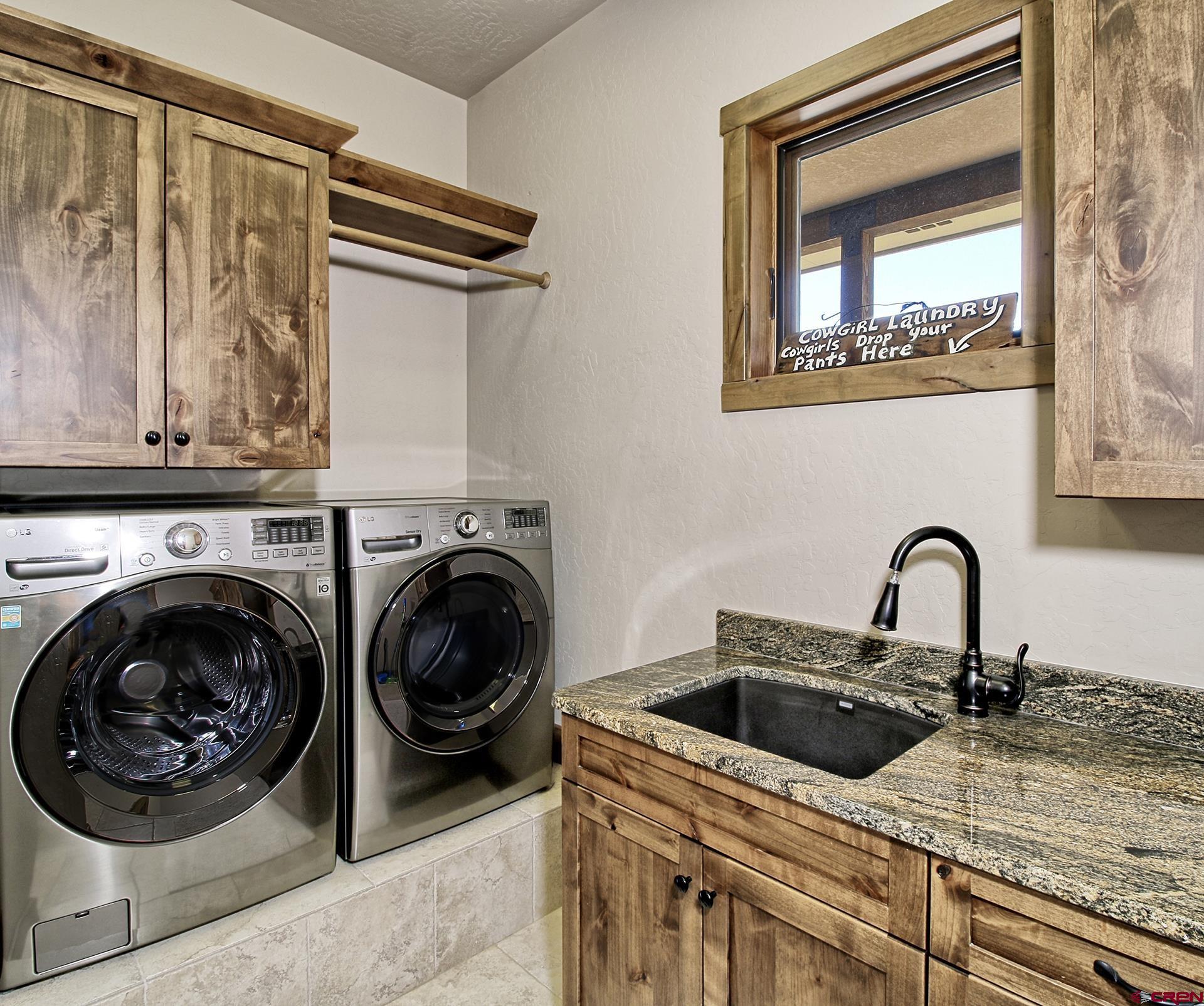 971 24 Road Grand Junction, CO 81505 - Photo 31 of 43 a kitchen with a stove and a sink