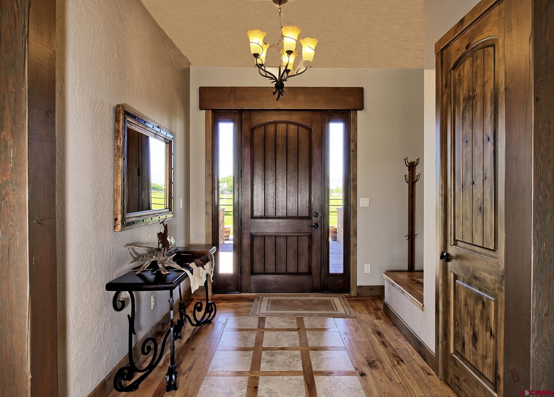 971 24 Road Grand Junction, CO 81505 - Photo 4 of 43 a view of hallway with chandelier