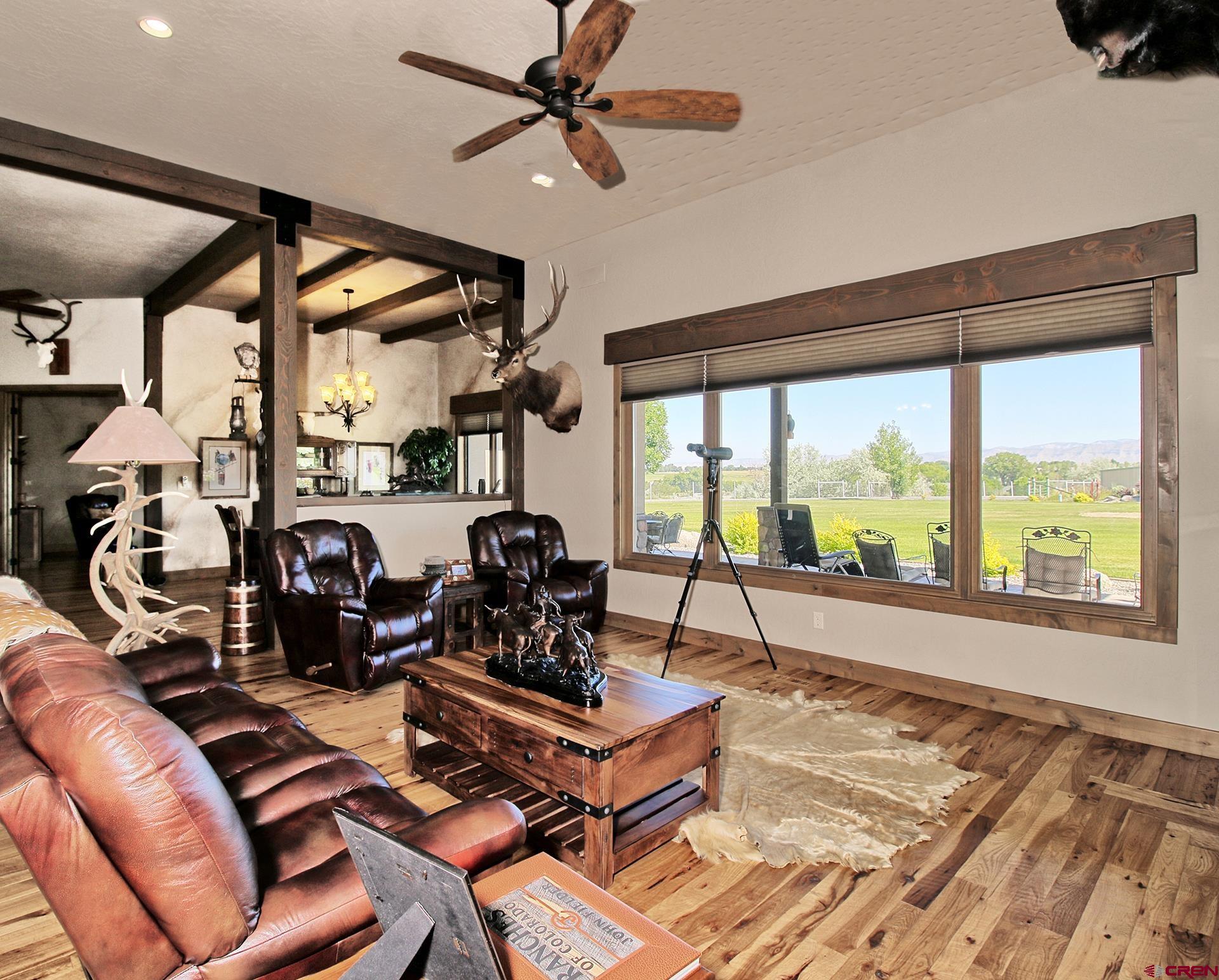 971 24 Road Grand Junction, CO 81505 - Photo 7 of 43 a living room with furniture and a large window