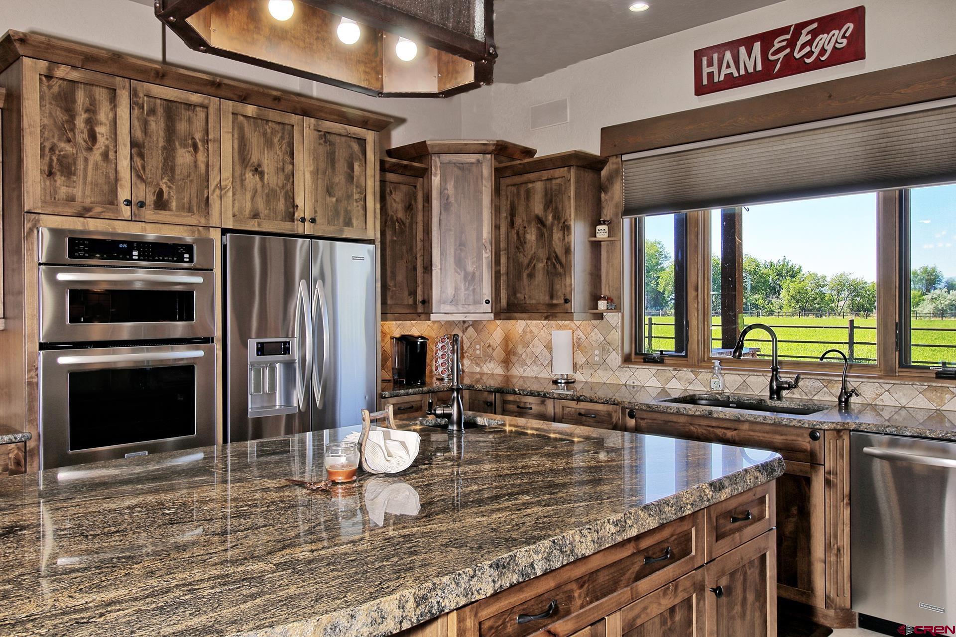 971 24 Road Grand Junction, CO 81505 - Photo 10 of 43 a kitchen with sink refrigerator and window