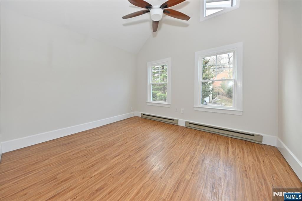 205 Union Street, Unit 2 Ridgewood, NJ 07450 - Photo 12 of 24 wooden floor in an empty room with a window