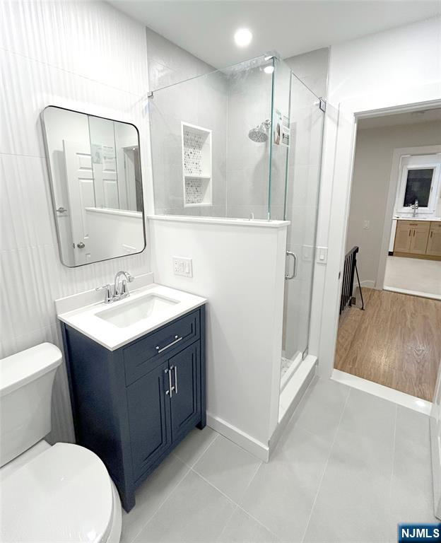 205 Union Street, Unit 2 Ridgewood, NJ 07450 - Photo 20 of 24 a bathroom with a sink vanity mirror and toilet