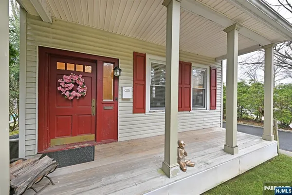 a front view of a house with a porch