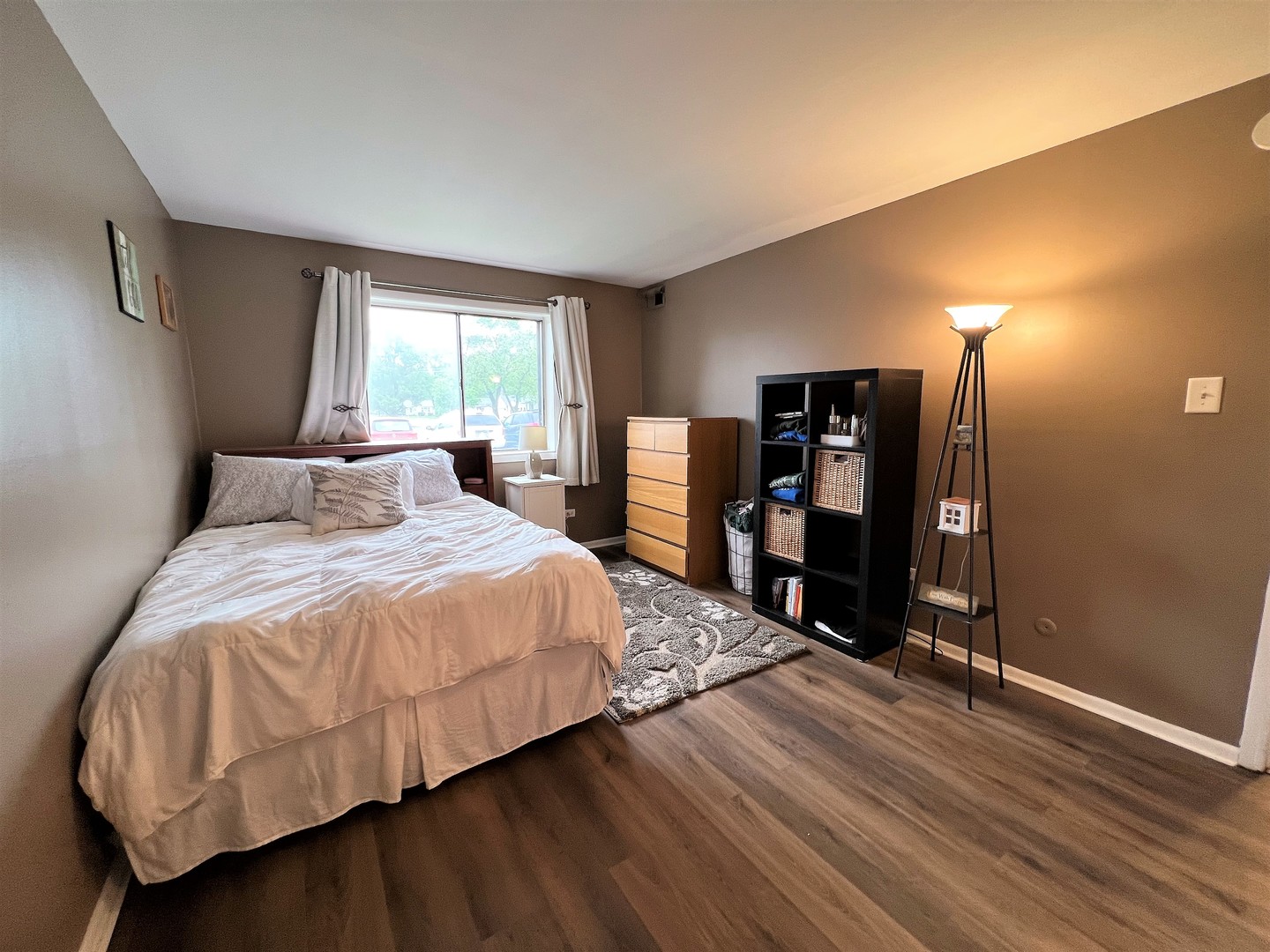 14970 Pulaski Road, Unit 2 Midlothian, IL 60445 - Photo 11 of 20 a bedroom with a bed and a large window with wooden floor