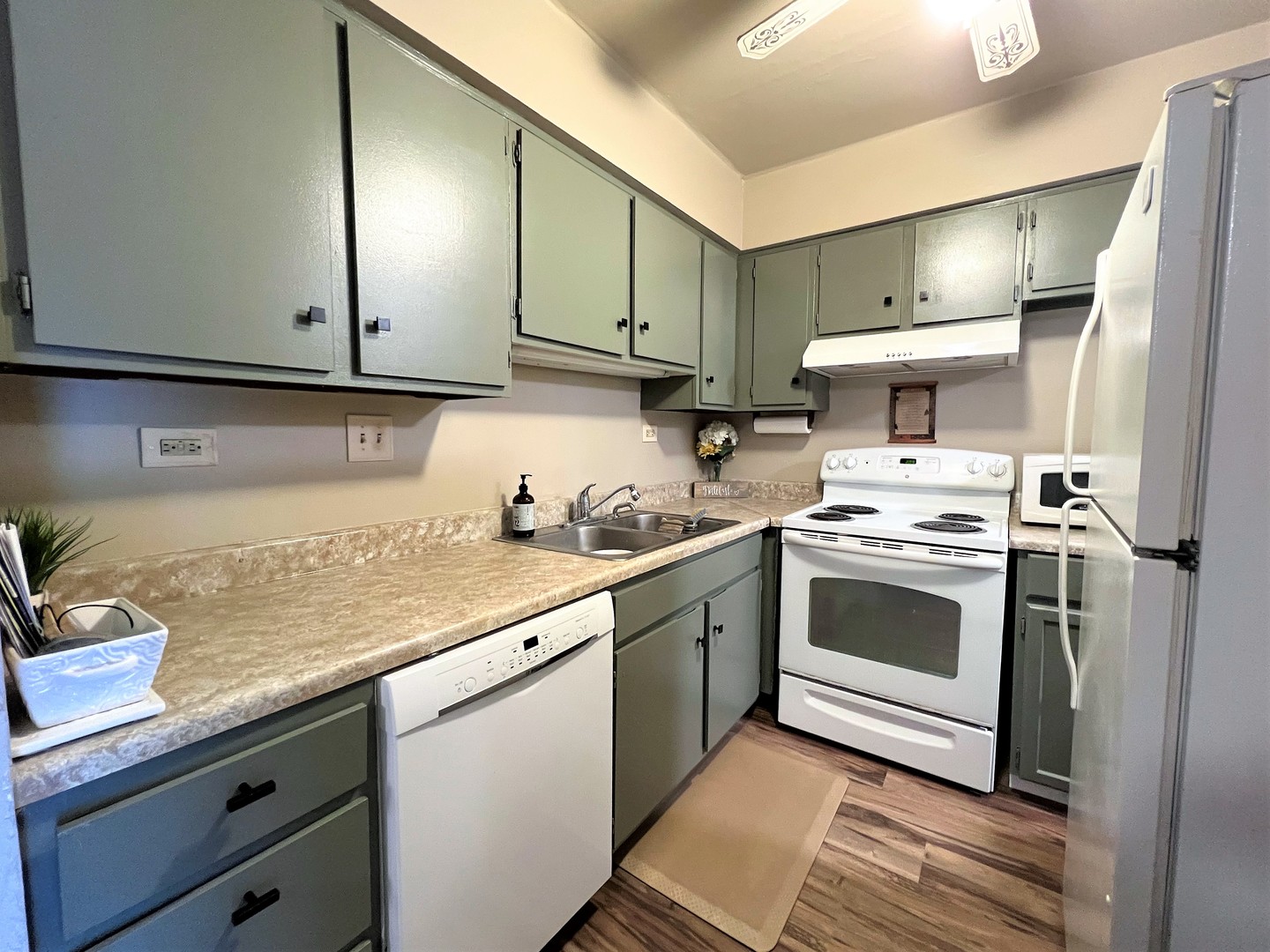 14970 Pulaski Road, Unit 2 Midlothian, IL 60445 - Photo 7 of 20 a kitchen with granite countertop a sink stainless steel appliances and cabinets