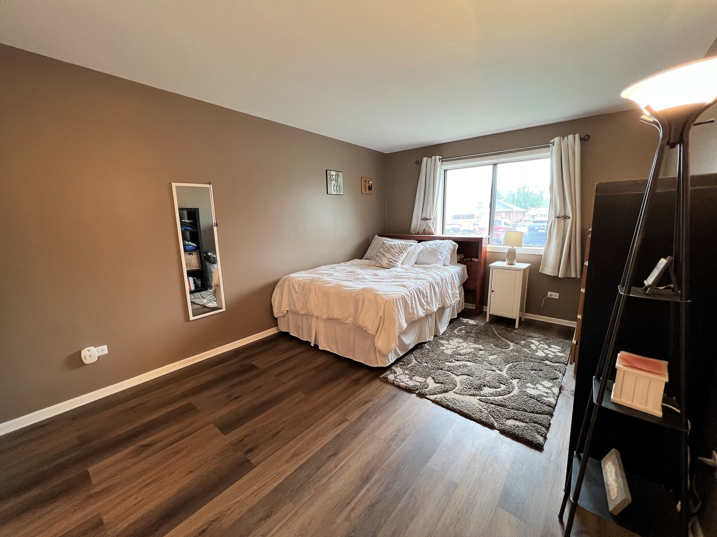 14970 Pulaski Road, Unit 2 Midlothian, IL 60445 - Photo 10 of 20 a bedroom with a bed and wooden floor