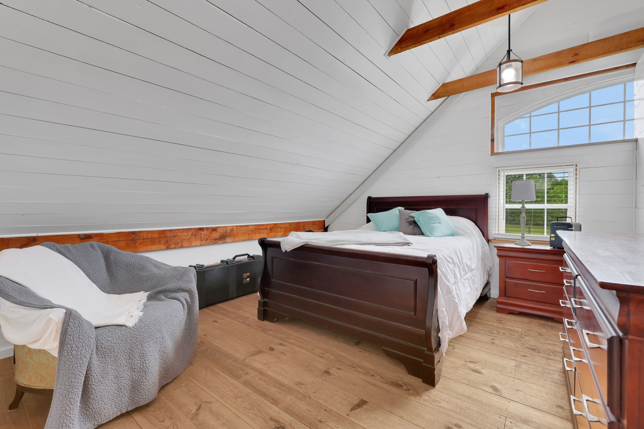 133 Timber Ridge Road Liberty, TX 77575 - Photo 23 of 29 a bedroom with bed and wooden floor