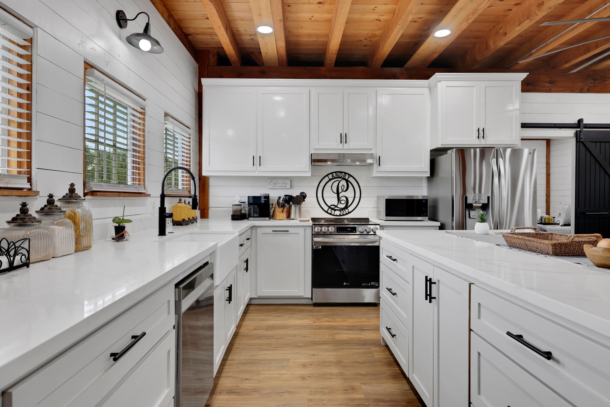 133 Timber Ridge Road Liberty, TX 77575 - Photo 8 of 29 a kitchen with stainless steel appliances a sink cabinets and a refrigerator