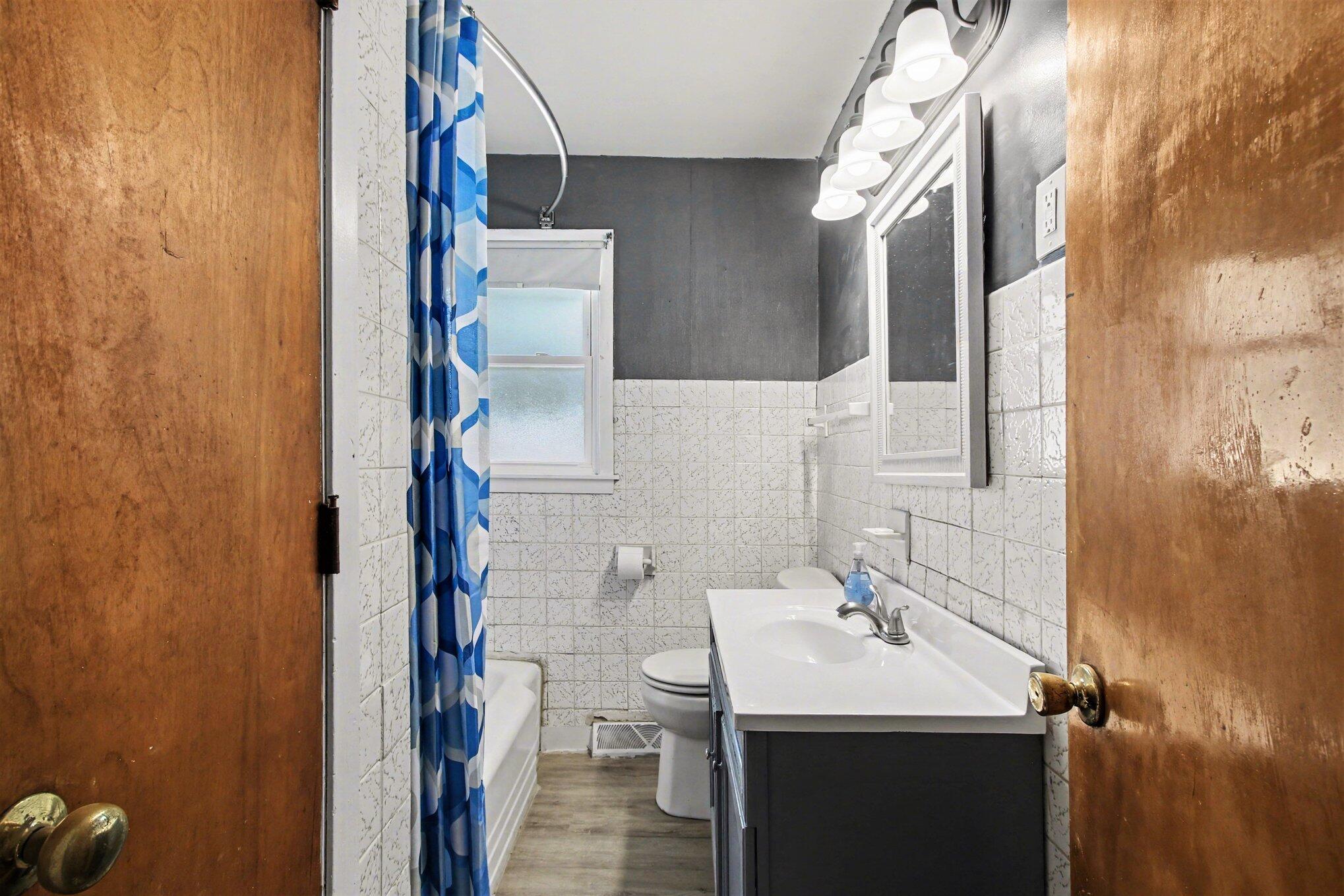 1741 Cleveland Street Gary, IN 46404 - Photo 8 of 16 a bathroom with a sink and a mirror