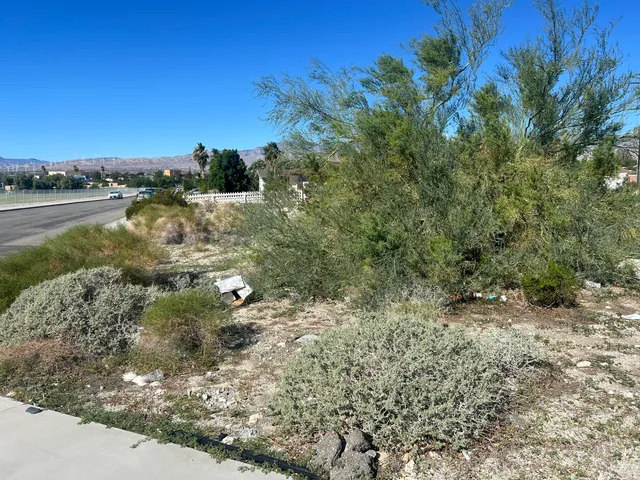 a view of a road with an ocean view