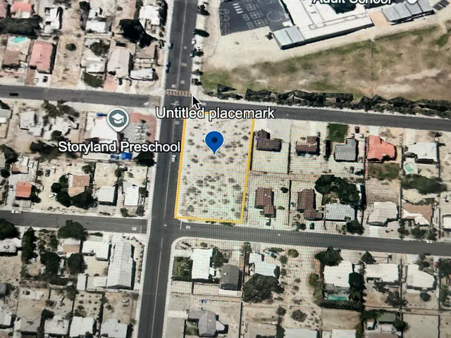 a view of a field with an ocean