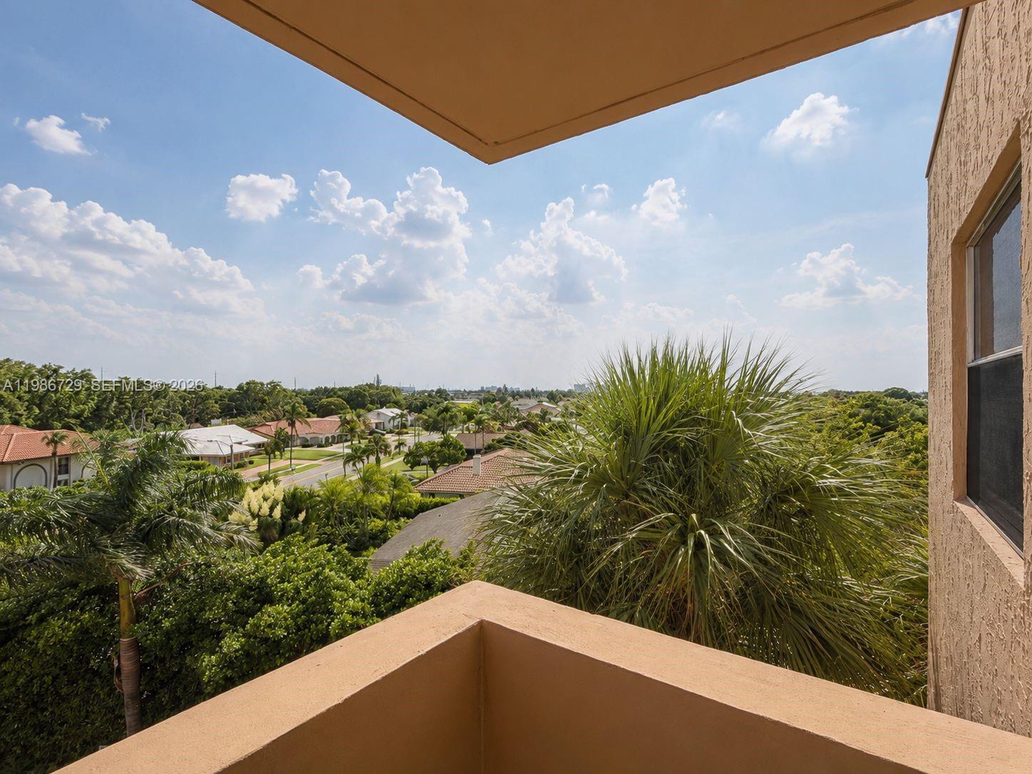 299 Northwest 52nd Terrace, Unit PHX Boca Raton, FL 33487 - Photo 15 of 16 a view of a street
