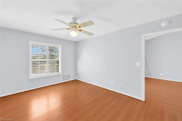 a view of an empty room with a window