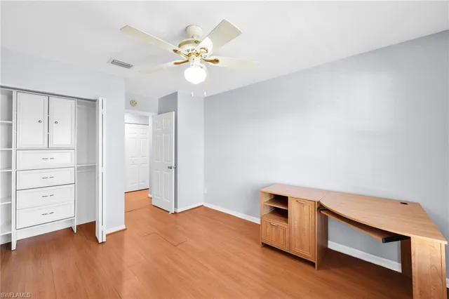 a view of a kitchen with a sink and cabinet